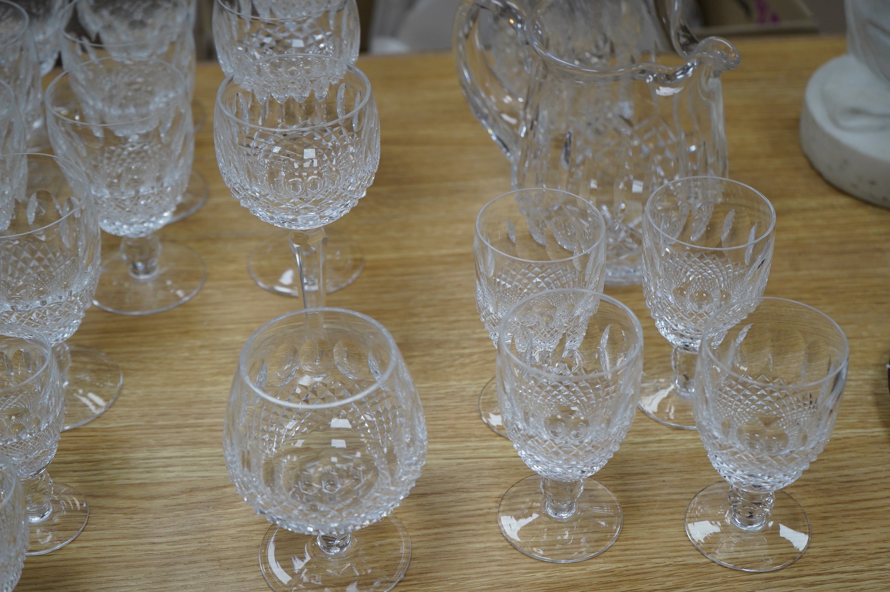 A Waterford Colleen pattern part suite of table glass including decanter, jug and glasses, largest 26cm high. Condition - mostly good